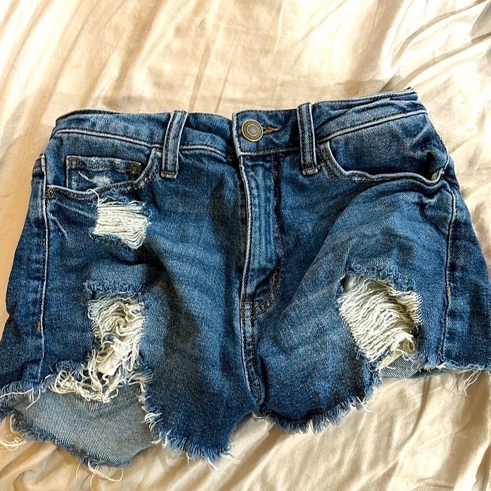 High wasted jean shorts cut off ropes at the bottom
